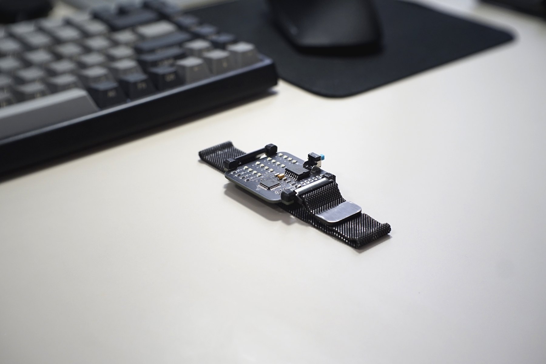 BinWatch resting on a desk beside a keyboard