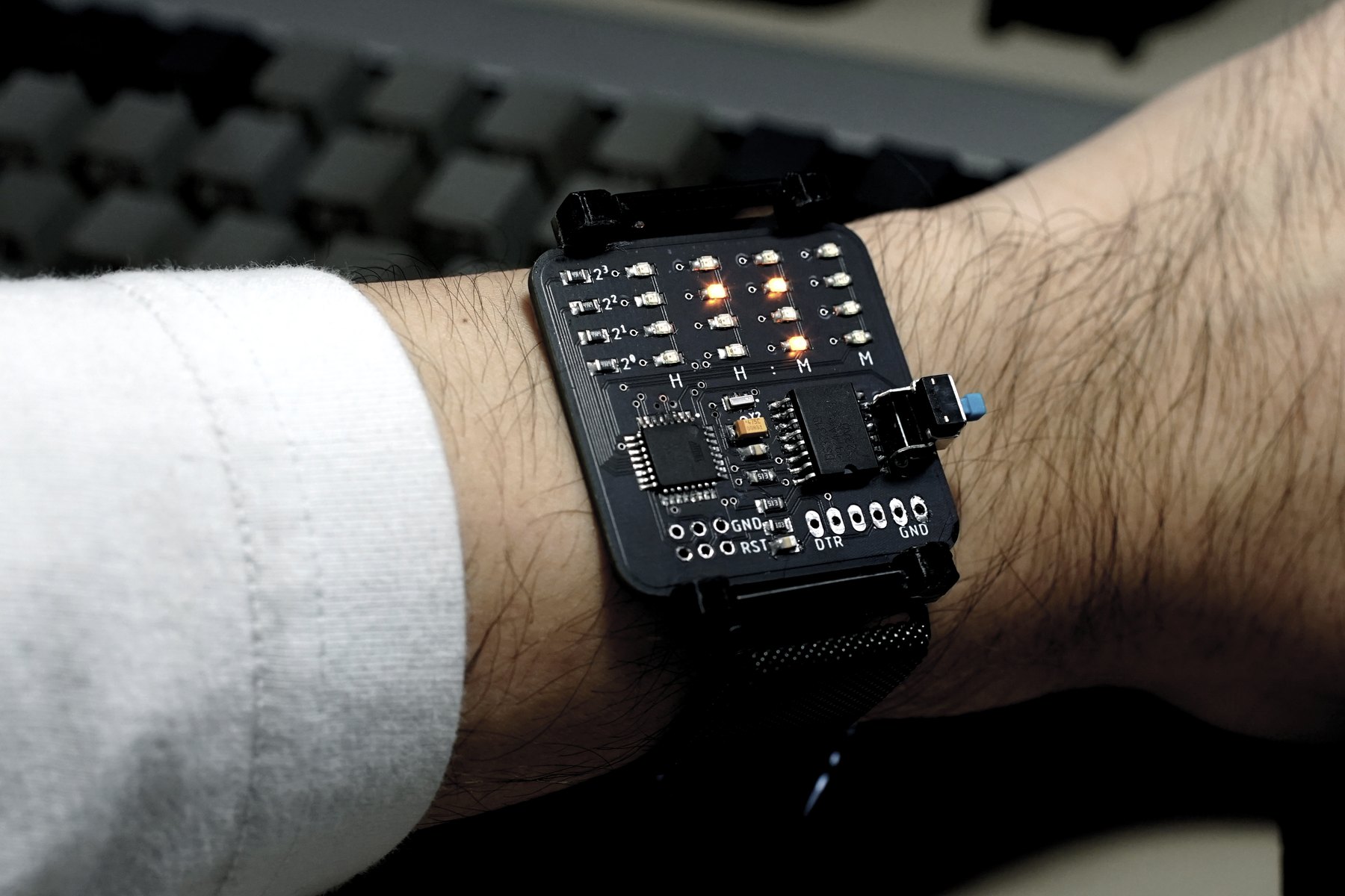 BinWatch displaying illuminated LEDs while worn on a wrist